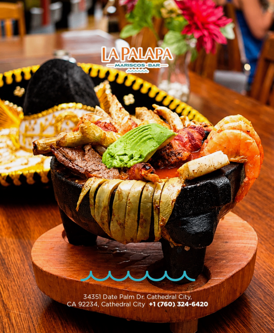 Seafood molcajete with shrimp, octopus, steak and avocado.