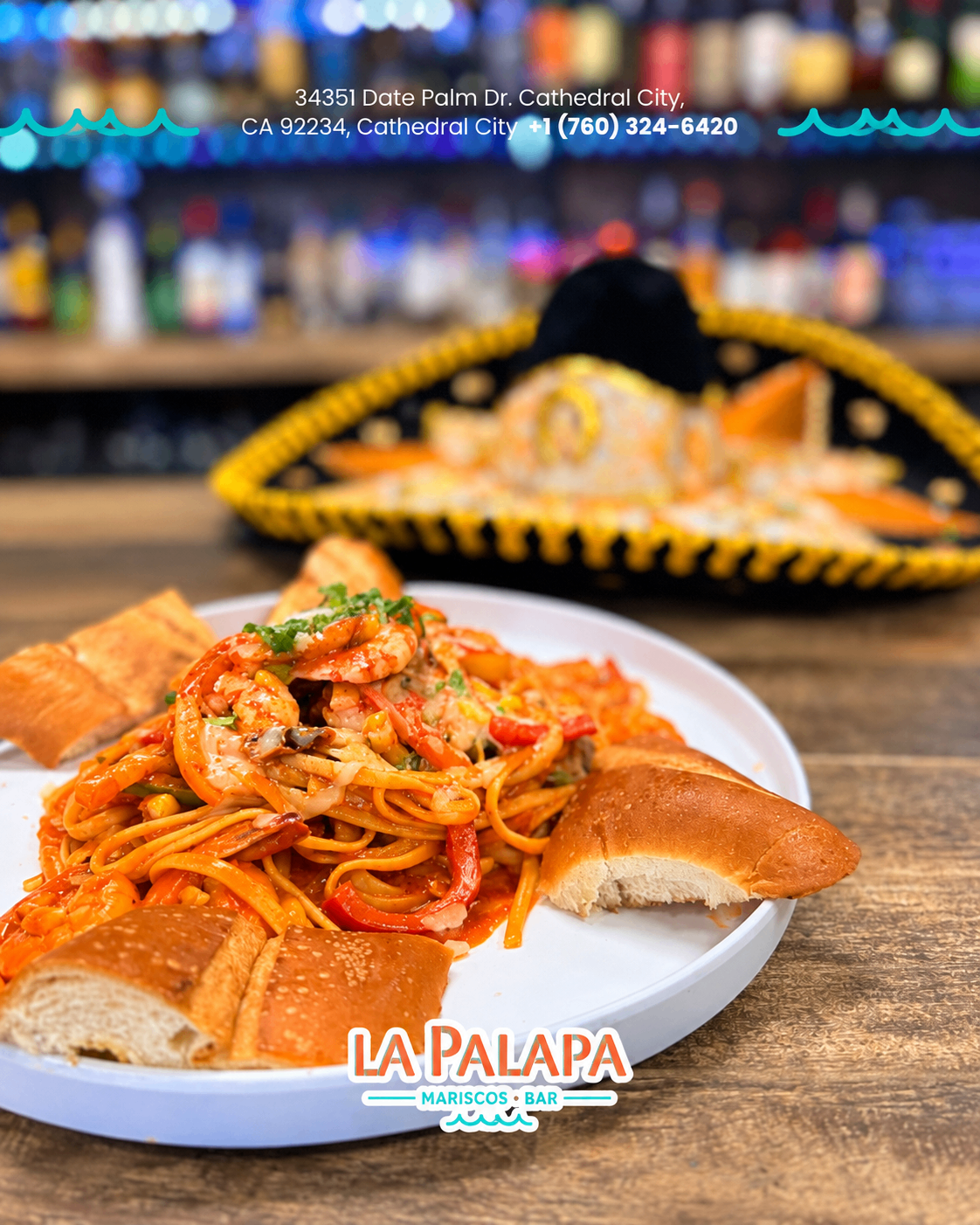Seafood pasta with shrimp and vegetables served with bread.